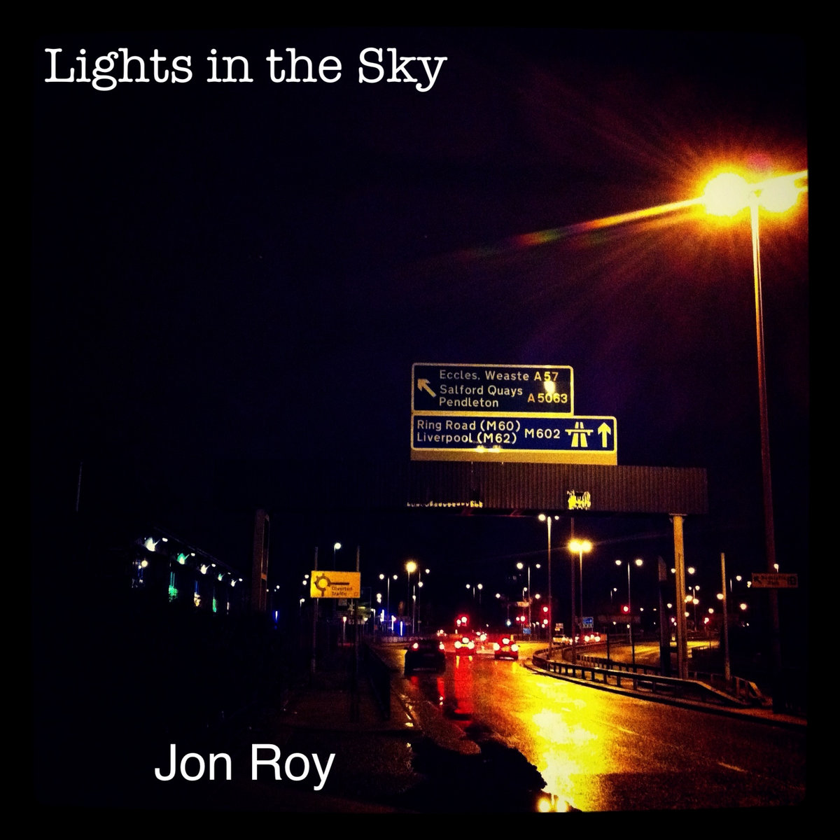Lights in the Sky EP cover art — a motorway sign lit at night on the M60 near Salford Quays