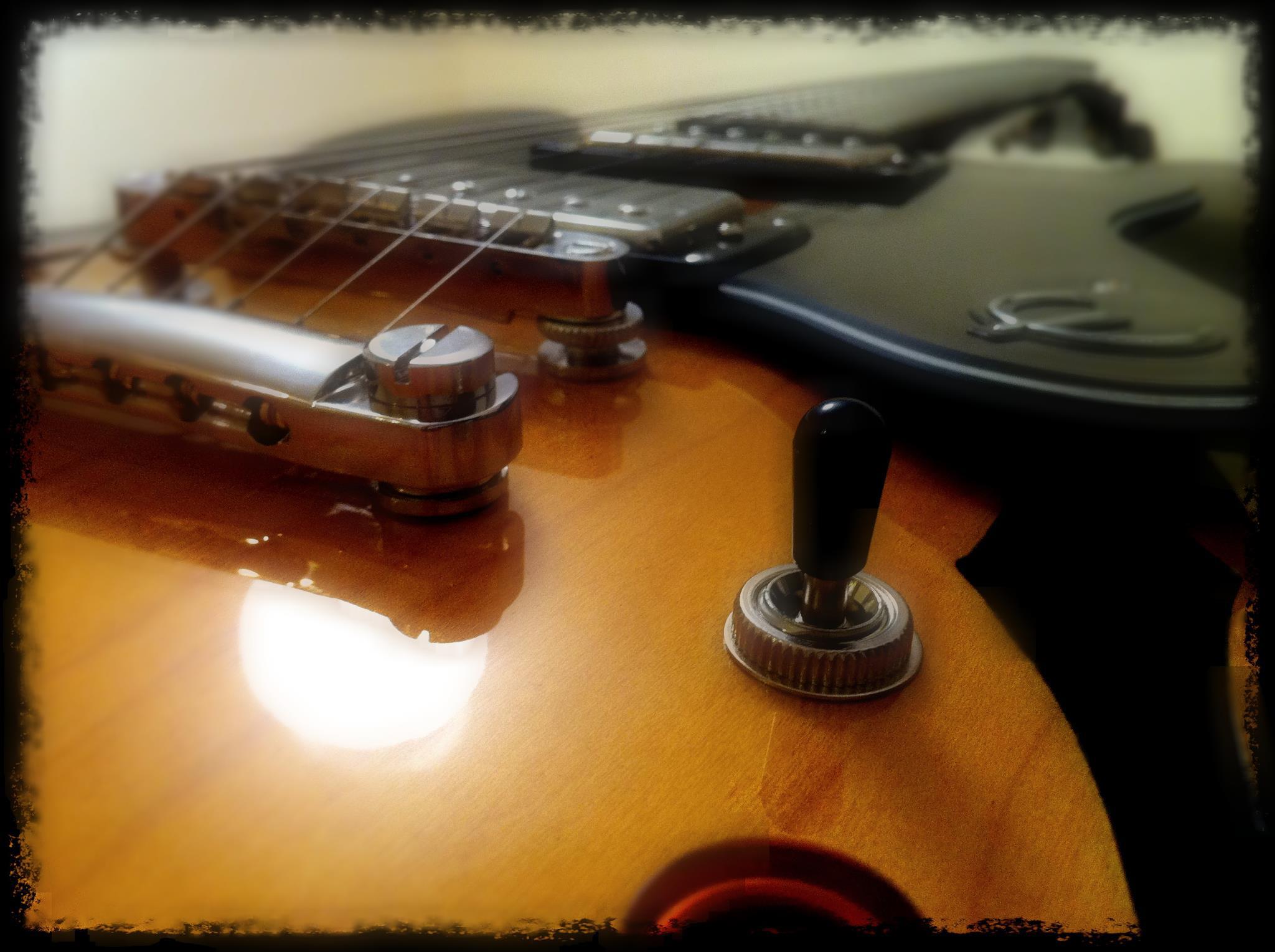 Close-up of a sunburst electric guitar body and toggle switch